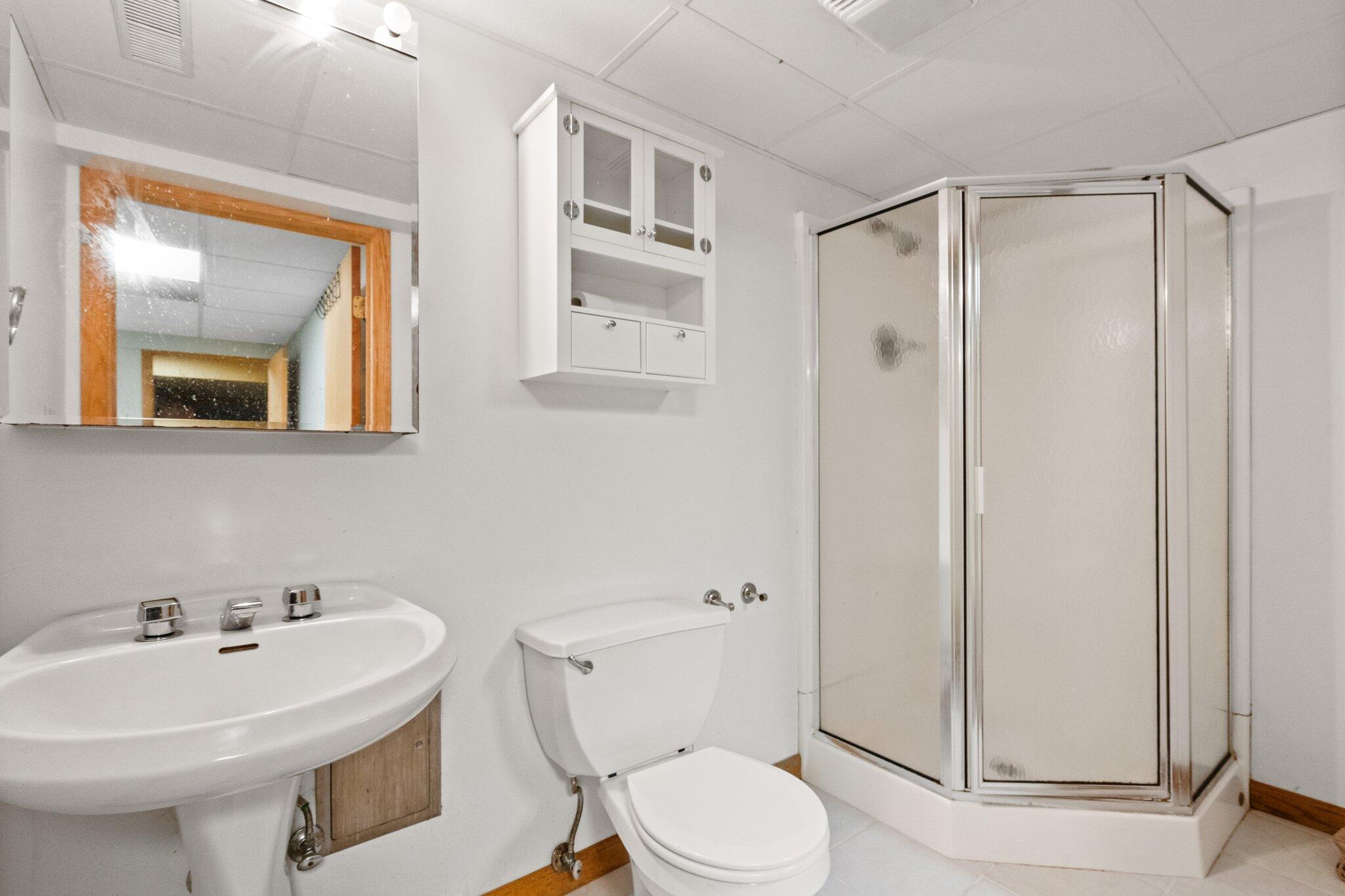 6614 Ridgeview Drive Demotte, IN 46310 - Photo 38 of 50 a bathroom with a sink toilet and shower