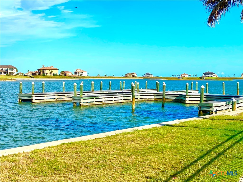68 West Tuscany Way Port O'Connor, TX 77982 - Photo 3 of 15 a view of swimming pool with outdoor seating and yard