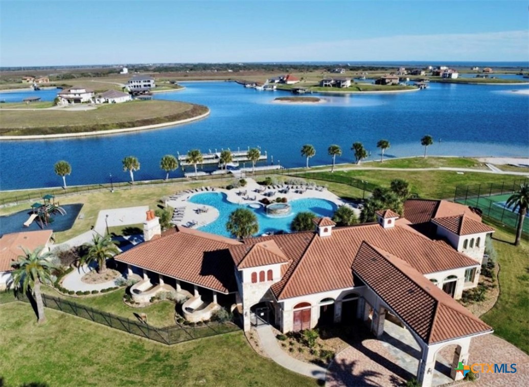 68 West Tuscany Way Port O'Connor, TX 77982 - Photo 6 of 15 an aerial view of residential houses with outdoor space and swimming pool