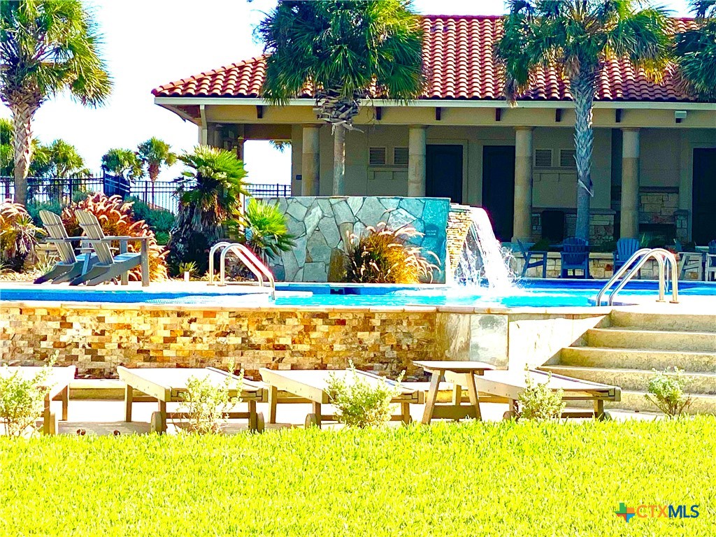 68 West Tuscany Way Port O'Connor, TX 77982 - Photo 10 of 15 a view of a swimming pool with an outdoor seating