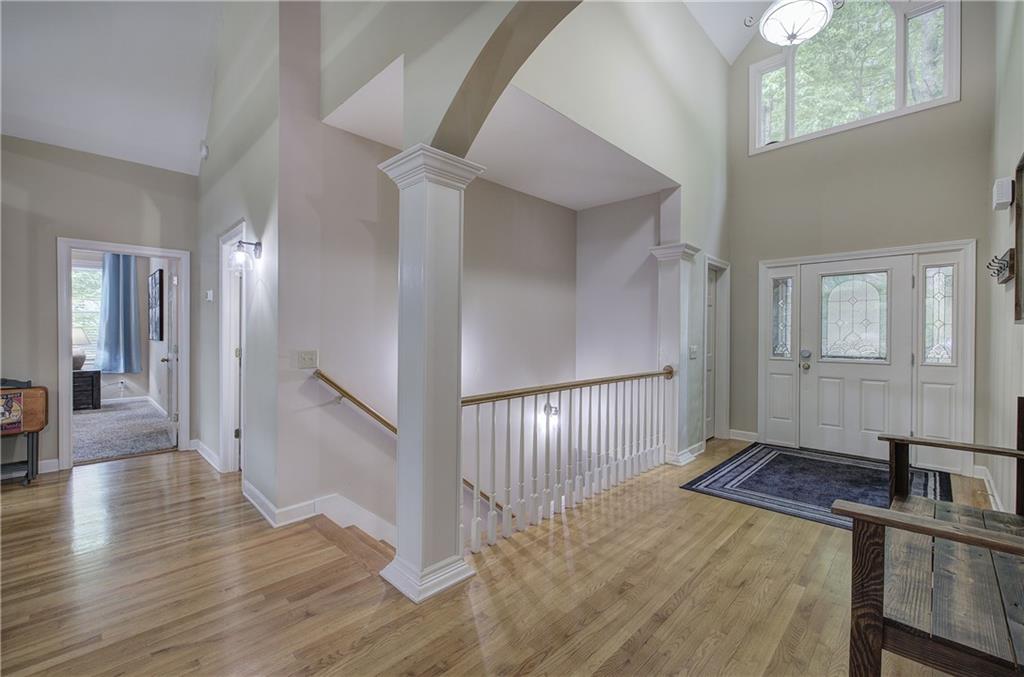 181 Fox Den Circle Jasper, GA 30143 - Photo 16 of 111 a view of a hallway with entryway wooden floor and front door