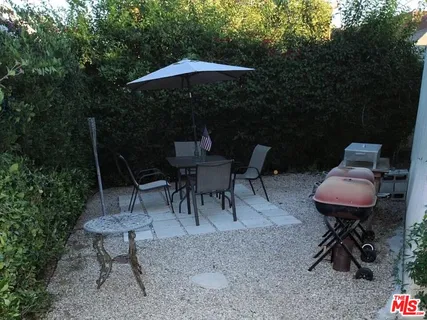 a view of a tables and chairs in the patio