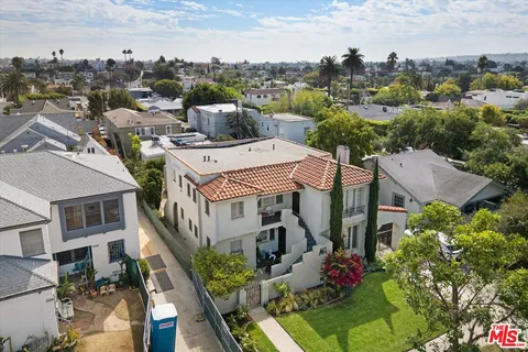 aerial view of a house with a street