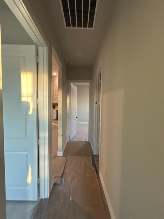 803 Vly Rdg Road Van Alstyne, TX 75495 - Photo 12 of 15 a view of a hallway with a livingroom and a bathroom with a sink