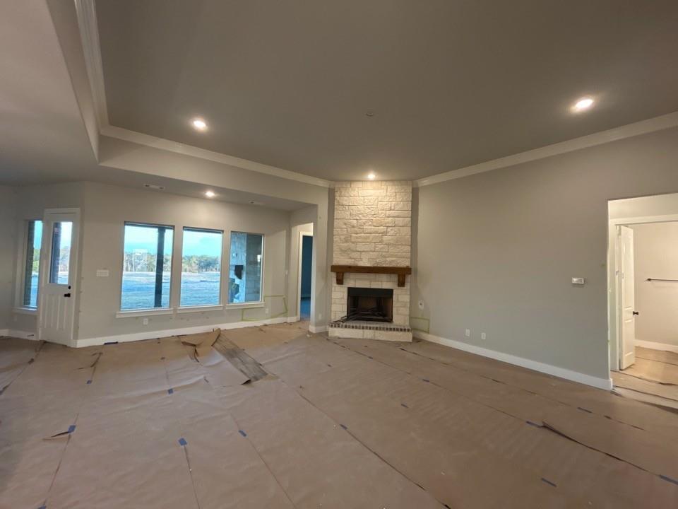 803 Vly Rdg Road Van Alstyne, TX 75495 - Photo 5 of 15 an empty room with fireplace and windows