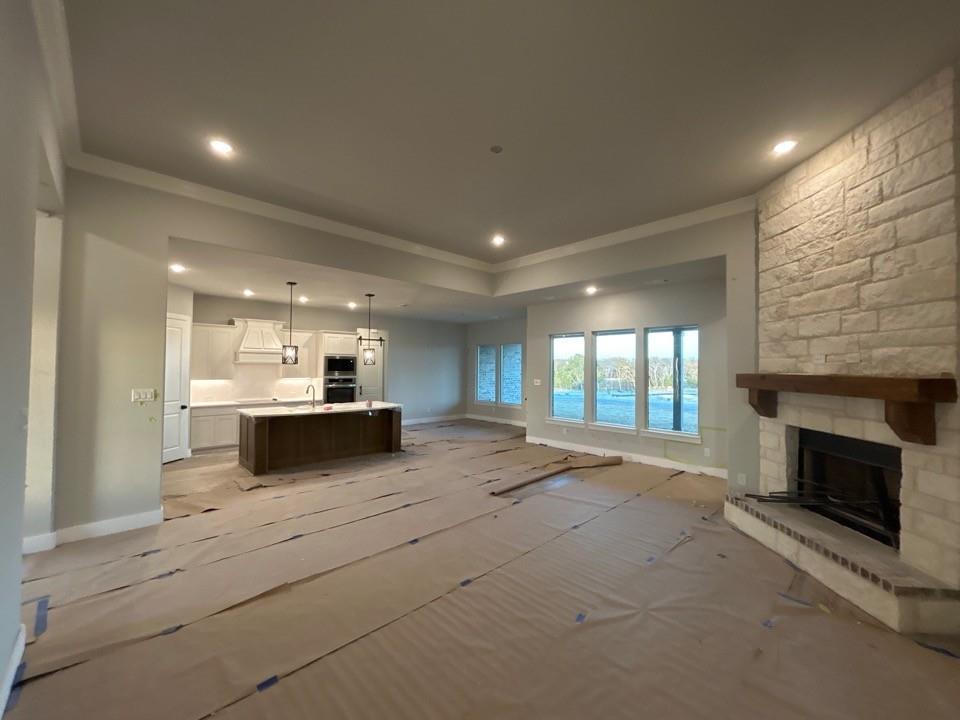 803 Vly Rdg Road Van Alstyne, TX 75495 - Photo 6 of 15 a view of a kitchen with a sink and a fireplace