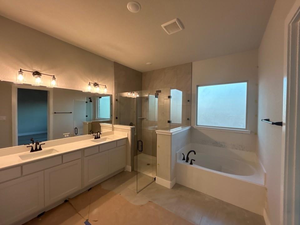 803 Vly Rdg Road Van Alstyne, TX 75495 - Photo 9 of 15 a bathroom with a tub sink shower and mirror