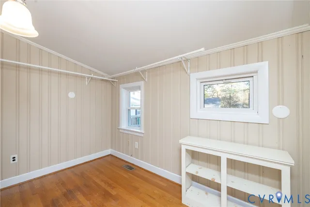 a bathroom with a sink vanity granite toilet and a mirror
