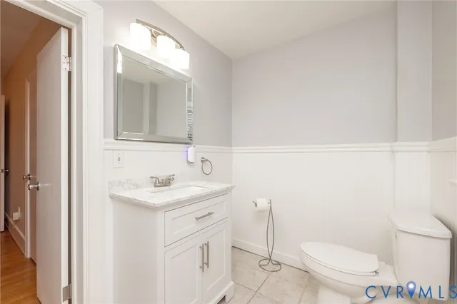 a view of a kitchen with a white cabinet and a stove top oven