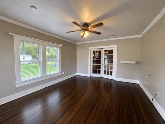 1726 7th Street Rosenberg, TX 77471 - Photo 3 of 17 French doors open to another room, enhancing the open feel of the space.