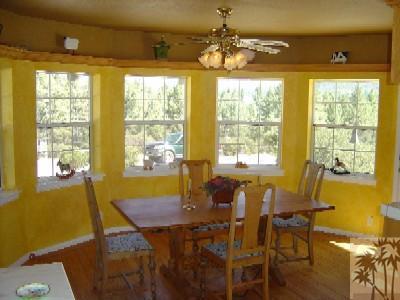 35680 Butterfly Peak Road Mountain Center, CA 92561 - Photo 11 of 19 a view of a dining room with furniture and windows