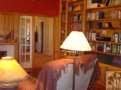 35680 Butterfly Peak Road Mountain Center, CA 92561 - Photo 15 of 19 a bed sitting in a bedroom next to a large book shelf
