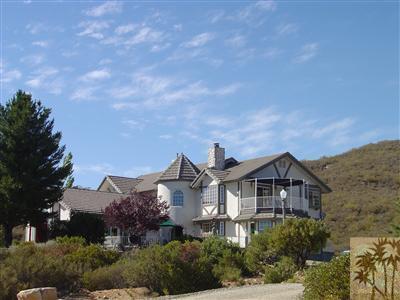 35680 Butterfly Peak Road Mountain Center, CA 92561 - Photo 2 of 19 aerial view of a house with a yard and balcony