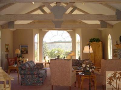 35680 Butterfly Peak Road Mountain Center, CA 92561 - Photo 4 of 19 a living room with furniture and a large window