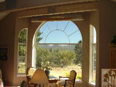 35680 Butterfly Peak Road Mountain Center, CA 92561 - Photo 7 of 19 a view of a room with large windows and furniture