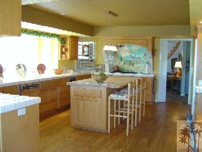35680 Butterfly Peak Road Mountain Center, CA 92561 - Photo 9 of 19 a view of a kitchen with furniture and wooden floor