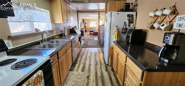 a view of a kitchen with a sink
