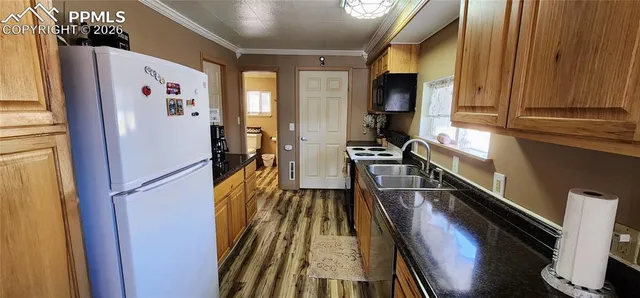 a kitchen with stainless steel appliances a refrigerator and a stove