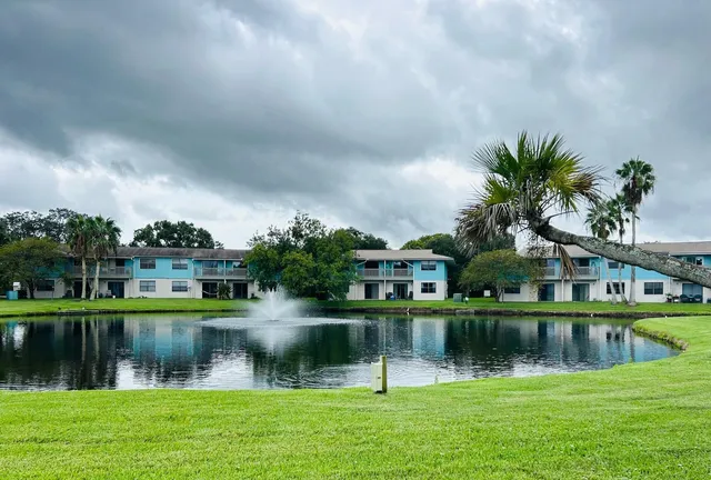 a view of lake with a house in the background