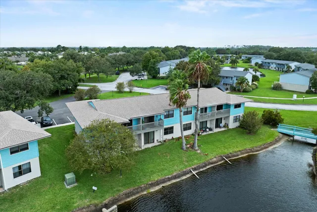 an aerial view of a house with a big yard