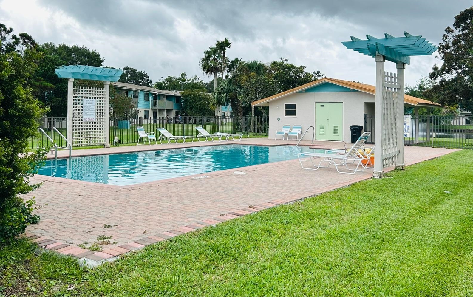 650 West Pope Road, Unit 208 St. Augustine, FL 32080 - Photo 27 of 35 a view of a house with backyard and a tree