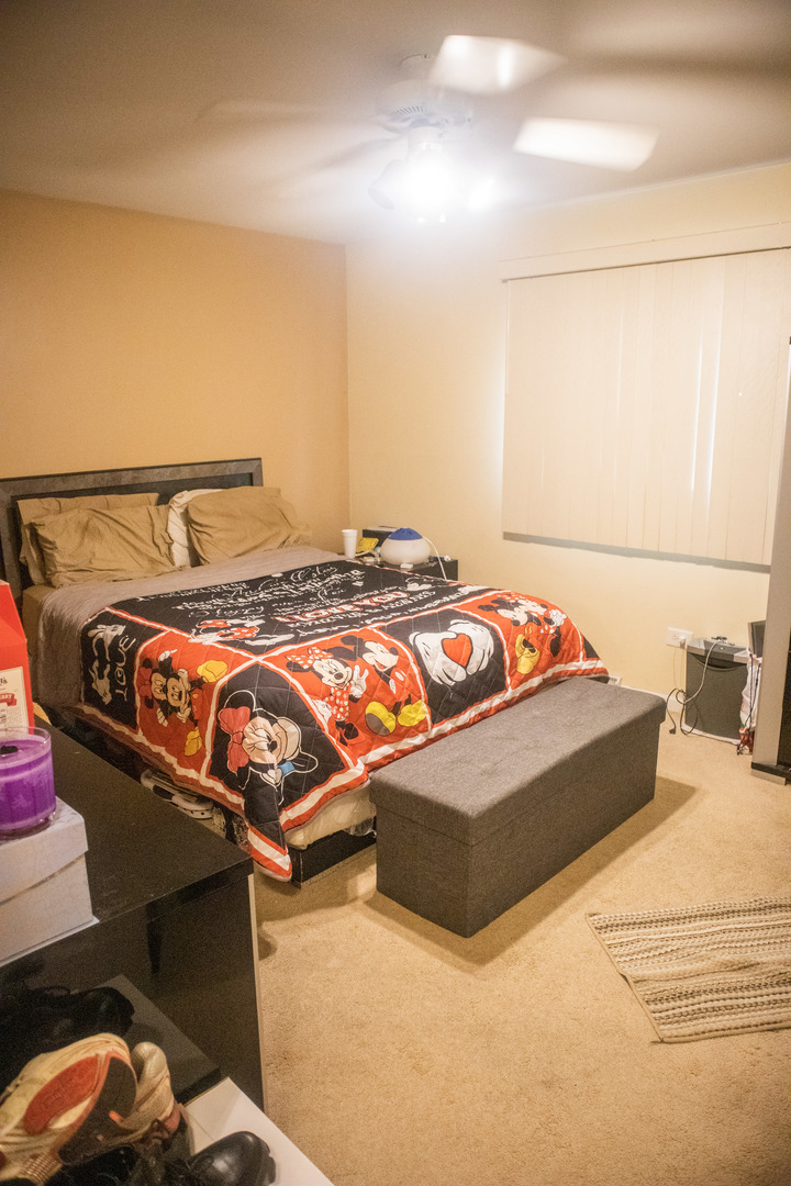 18339 Bock Road Lansing, IL 60438 - Photo 14 of 20 a bed sitting in a bedroom next to a window