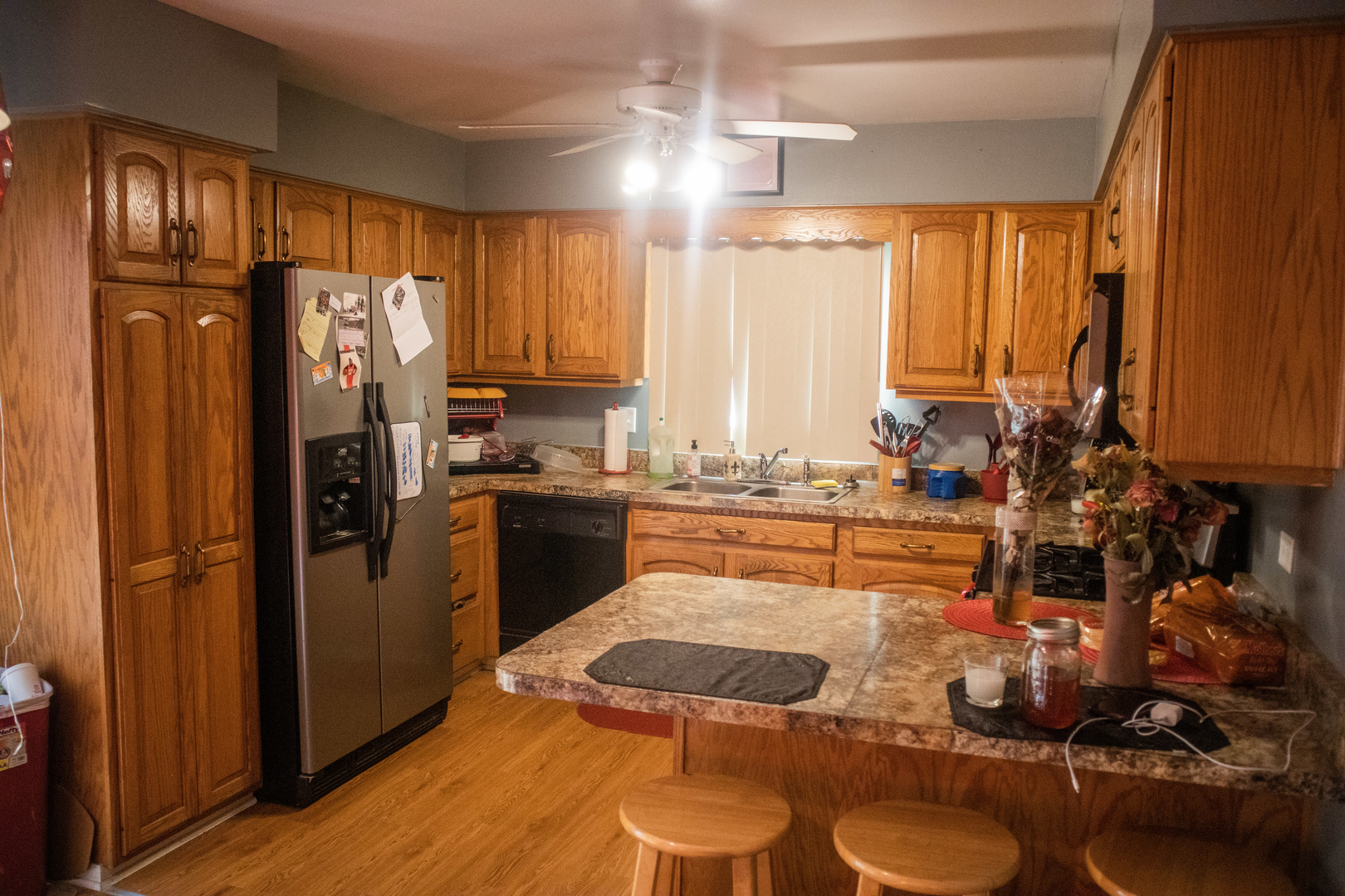 18339 Bock Road Lansing, IL 60438 - Photo 9 of 20 a kitchen with stainless steel appliances granite countertop a refrigerator a stove and a sink with wooden floor