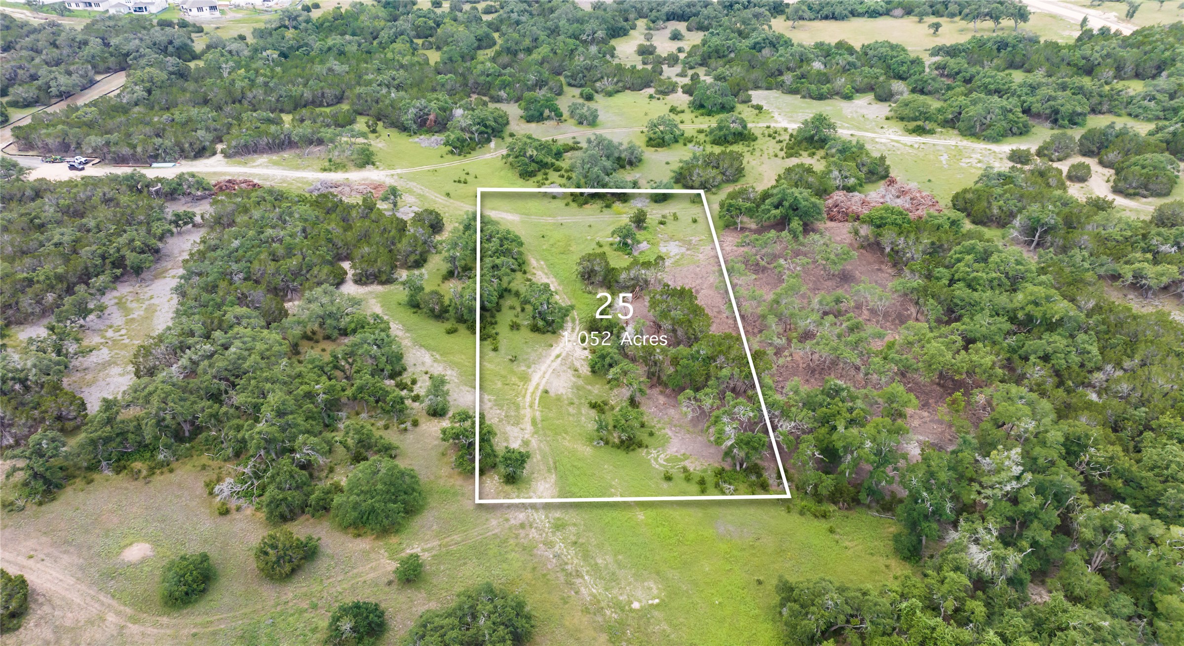 Tbd Evergreen Way Austin, TX 78737 - Photo 3 of 7 Aerial view of sparsely populated area featuring property parcel outlined and a tree filled landscape