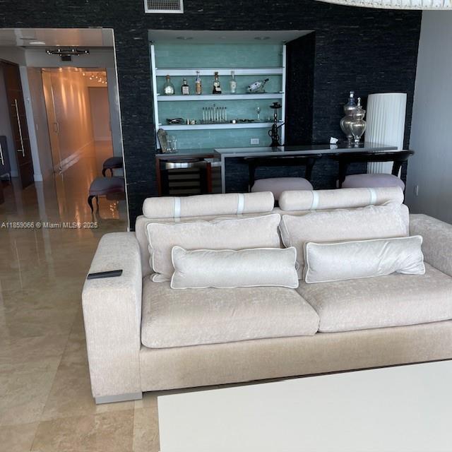 20201 East Country Club Drive, Unit 704 Aventura, FL 33180 - Photo 14 of 46 a living room with furniture and a fireplace