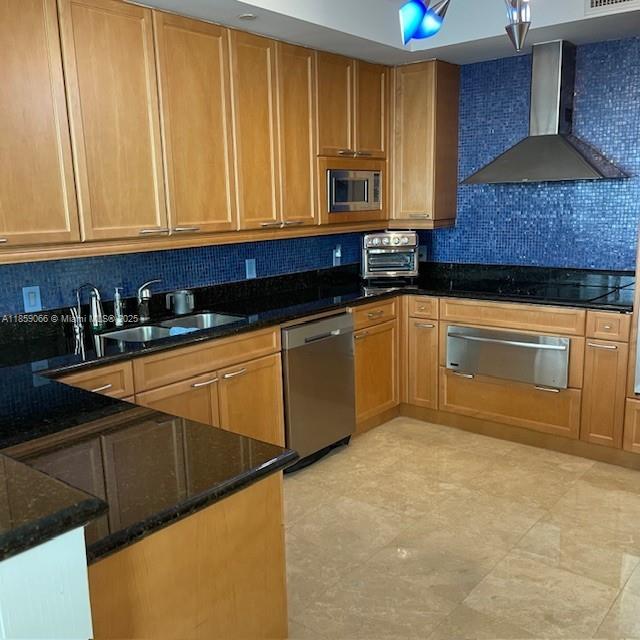 20201 East Country Club Drive, Unit 704 Aventura, FL 33180 - Photo 18 of 46 a kitchen with stainless steel appliances granite countertop a sink a stove a microwave a counter space and cabinets