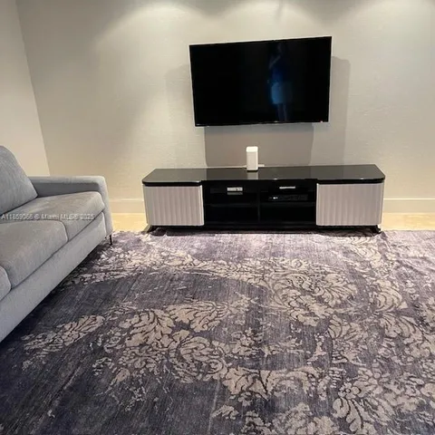 a living room with a couch and a stove