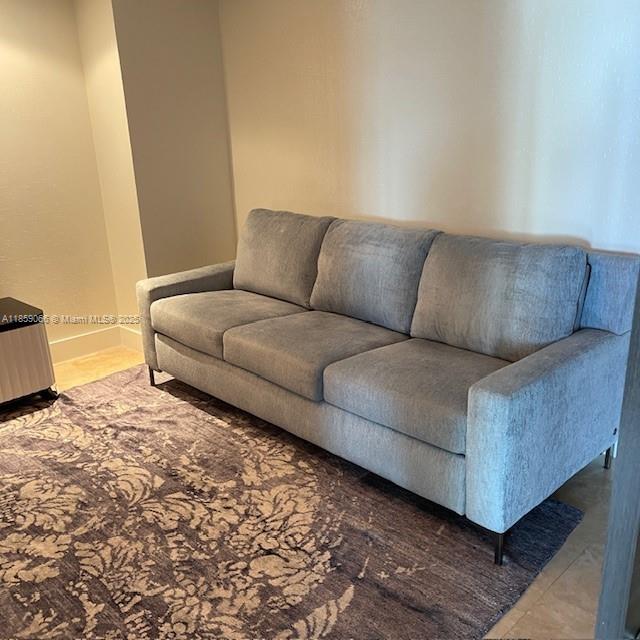 20201 East Country Club Drive, Unit 704 Aventura, FL 33180 - Photo 26 of 46 a living room with a couch and a stove