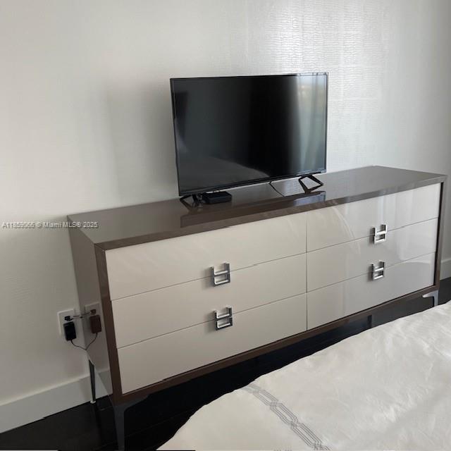 20201 East Country Club Drive, Unit 704 Aventura, FL 33180 - Photo 28 of 46 a room with a flat screen tv