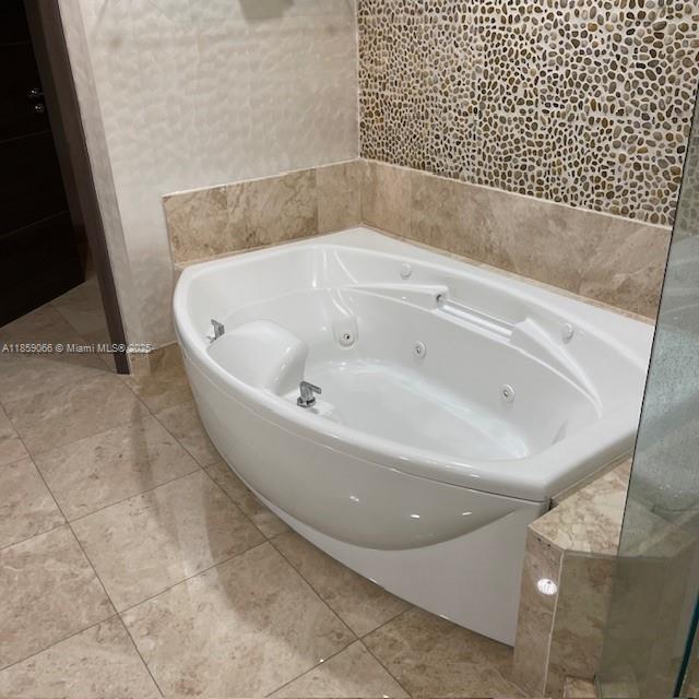20201 East Country Club Drive, Unit 704 Aventura, FL 33180 - Photo 31 of 46 a bathroom with a bathtub