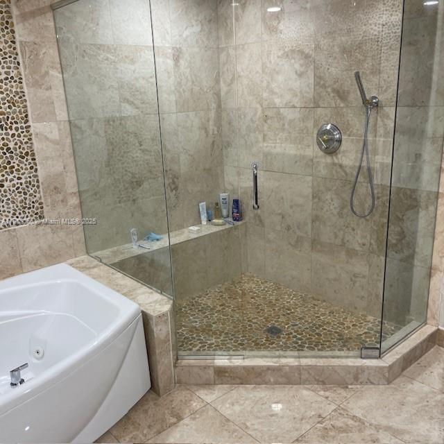 20201 East Country Club Drive, Unit 704 Aventura, FL 33180 - Photo 32 of 46 a bathroom with a bathtub and shower