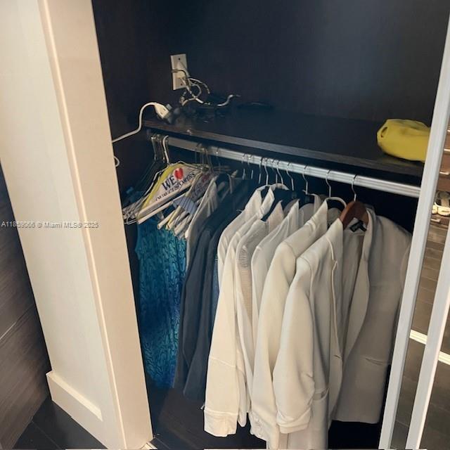 20201 East Country Club Drive, Unit 704 Aventura, FL 33180 - Photo 34 of 46 a close view of walk in closet with clothes and shoes