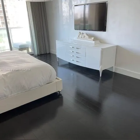 a bedroom with a bed and a table