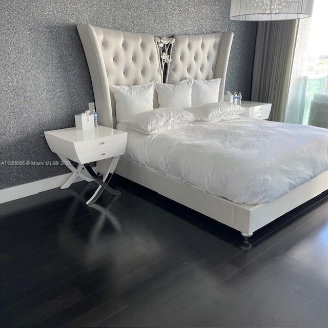 20201 East Country Club Drive, Unit 704 Aventura, FL 33180 - Photo 39 of 46 a bedroom with a bed and a table