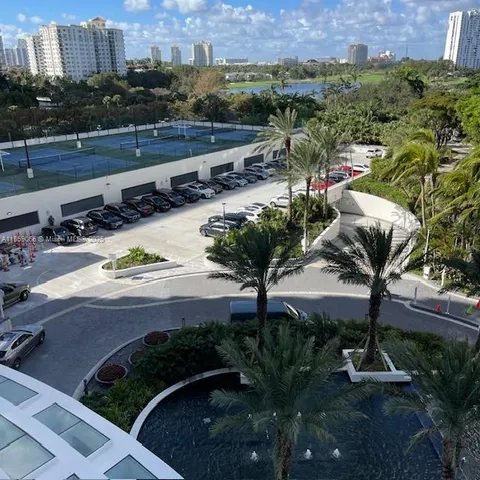 a view of a house with a yard and lake