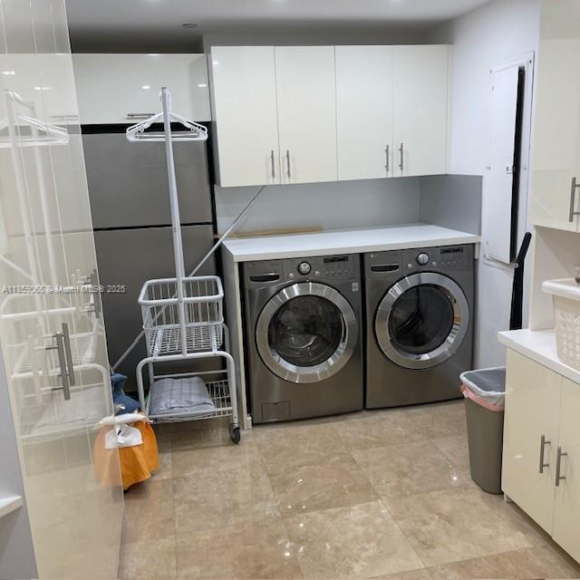 20201 East Country Club Drive, Unit 704 Aventura, FL 33180 - Photo 41 of 46 a utility room with dryer and washer