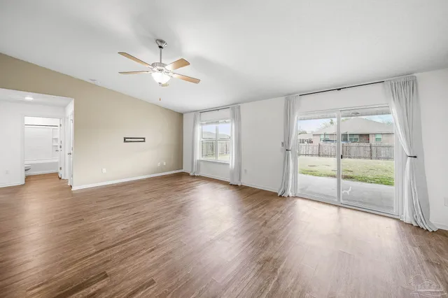 a view of a livingroom with wooden floor