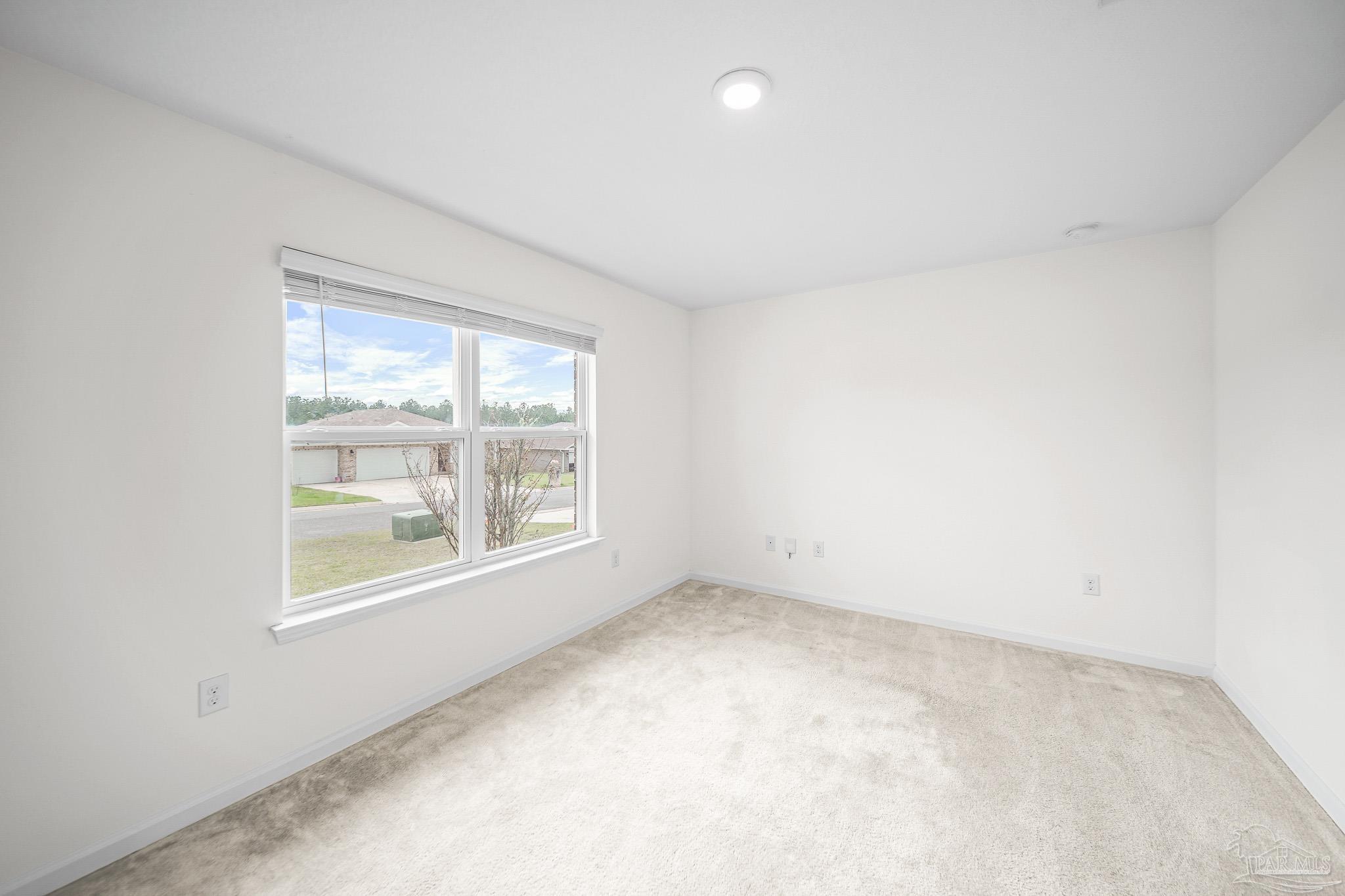 4706 Determination Court Milton, FL 32570 - Photo 17 of 34 an empty room with a window