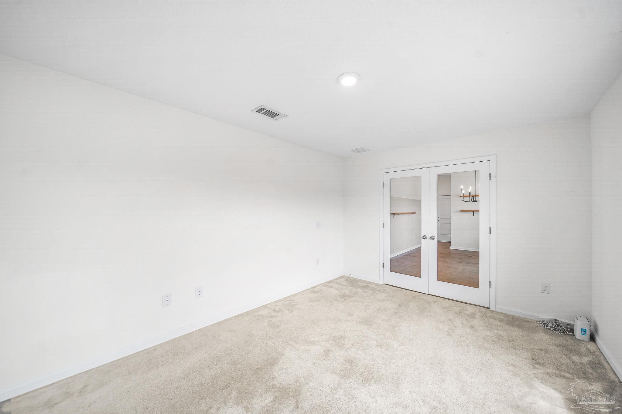 4706 Determination Court Milton, FL 32570 - Photo 18 of 34 an empty room with a natural light