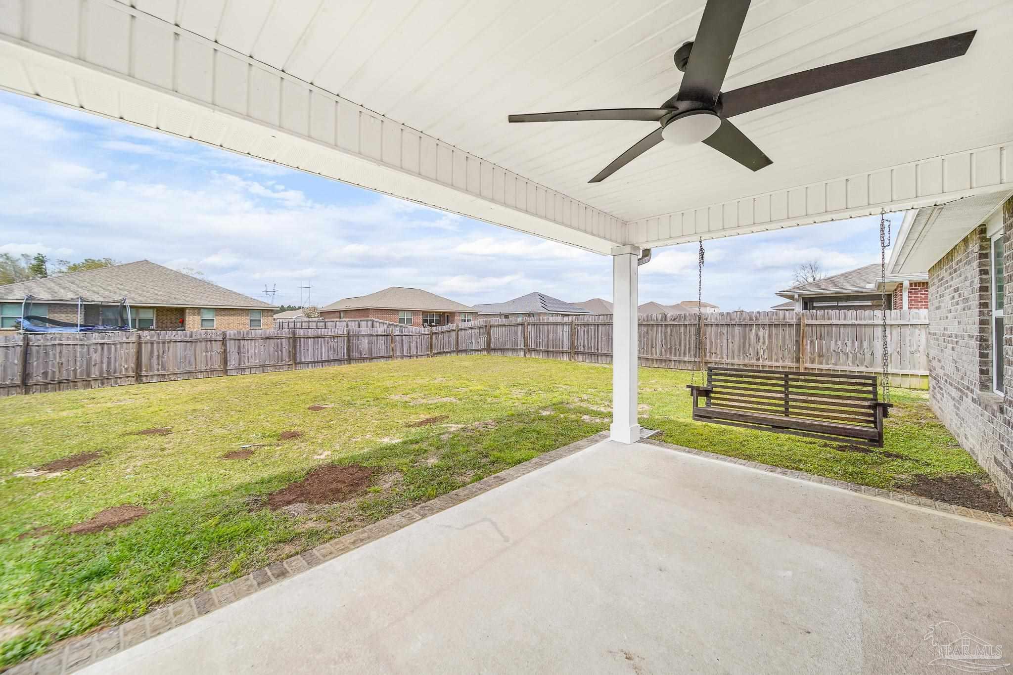 4706 Determination Court Milton, FL 32570 - Photo 31 of 34 a view of a swimming pool with a yard