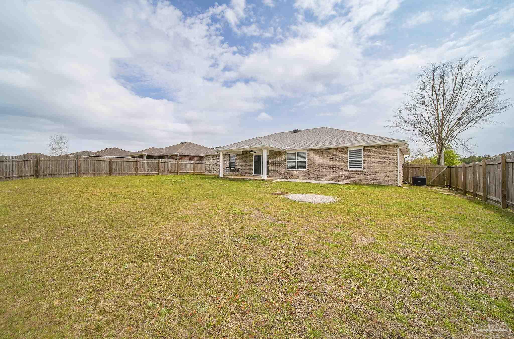 4706 Determination Court Milton, FL 32570 - Photo 33 of 34 a view of an aerial view of house with pool and ocean view