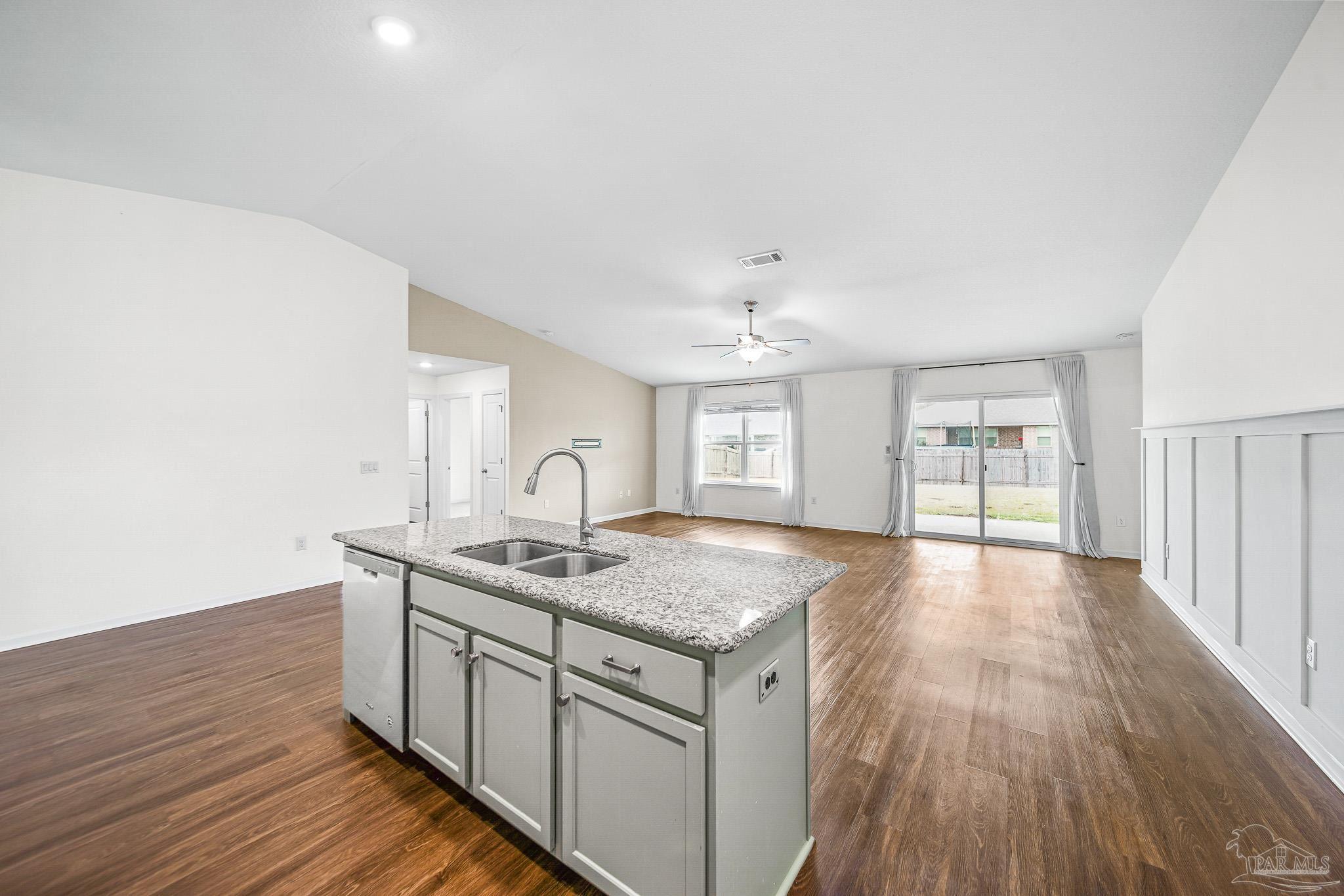 4706 Determination Court Milton, FL 32570 - Photo 7 of 34 a view of a kitchen counter space with wooden floor