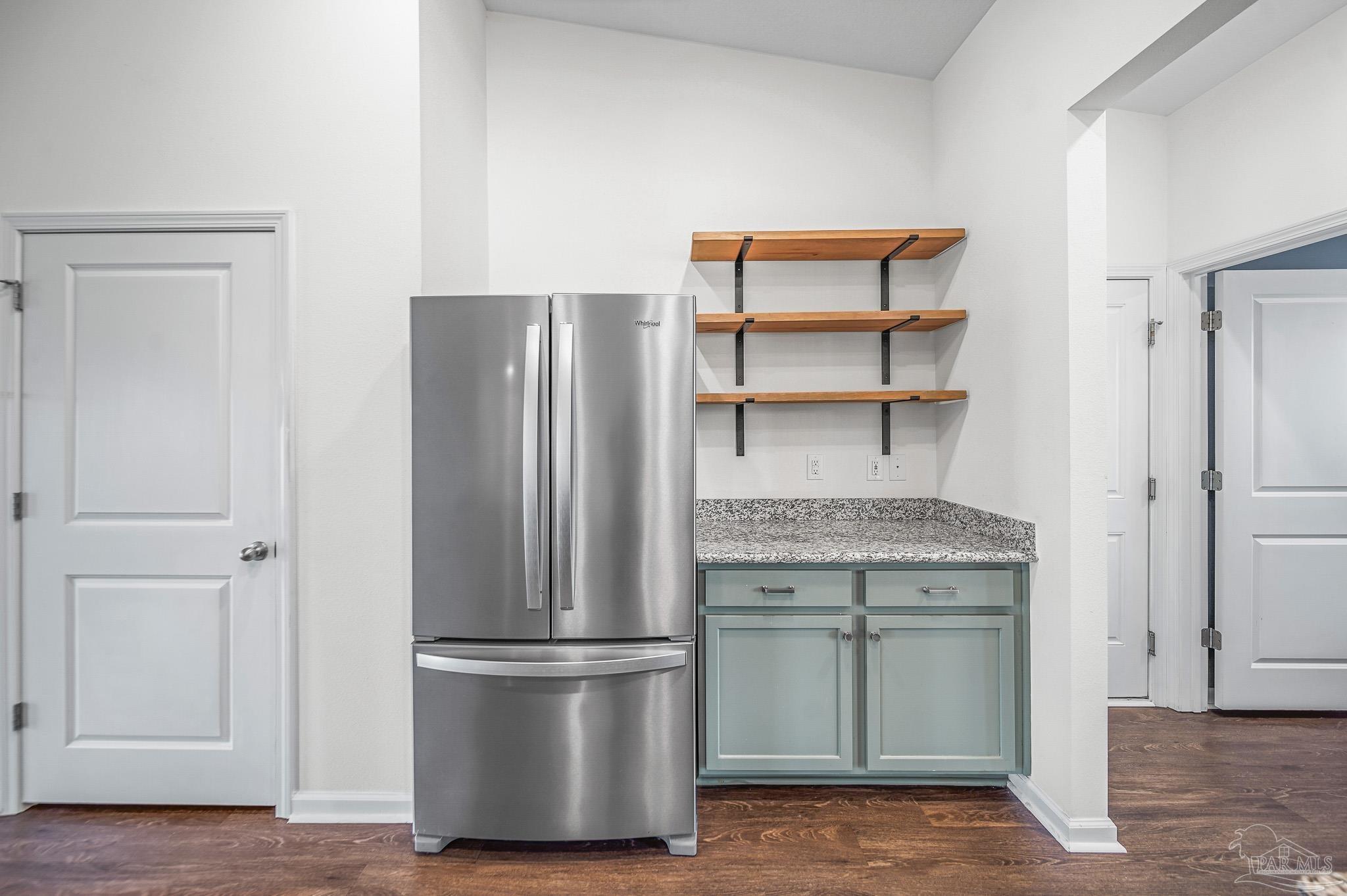 4706 Determination Court Milton, FL 32570 - Photo 9 of 34 a kitchen with stainless steel appliances granite countertop a refrigerator and a sink