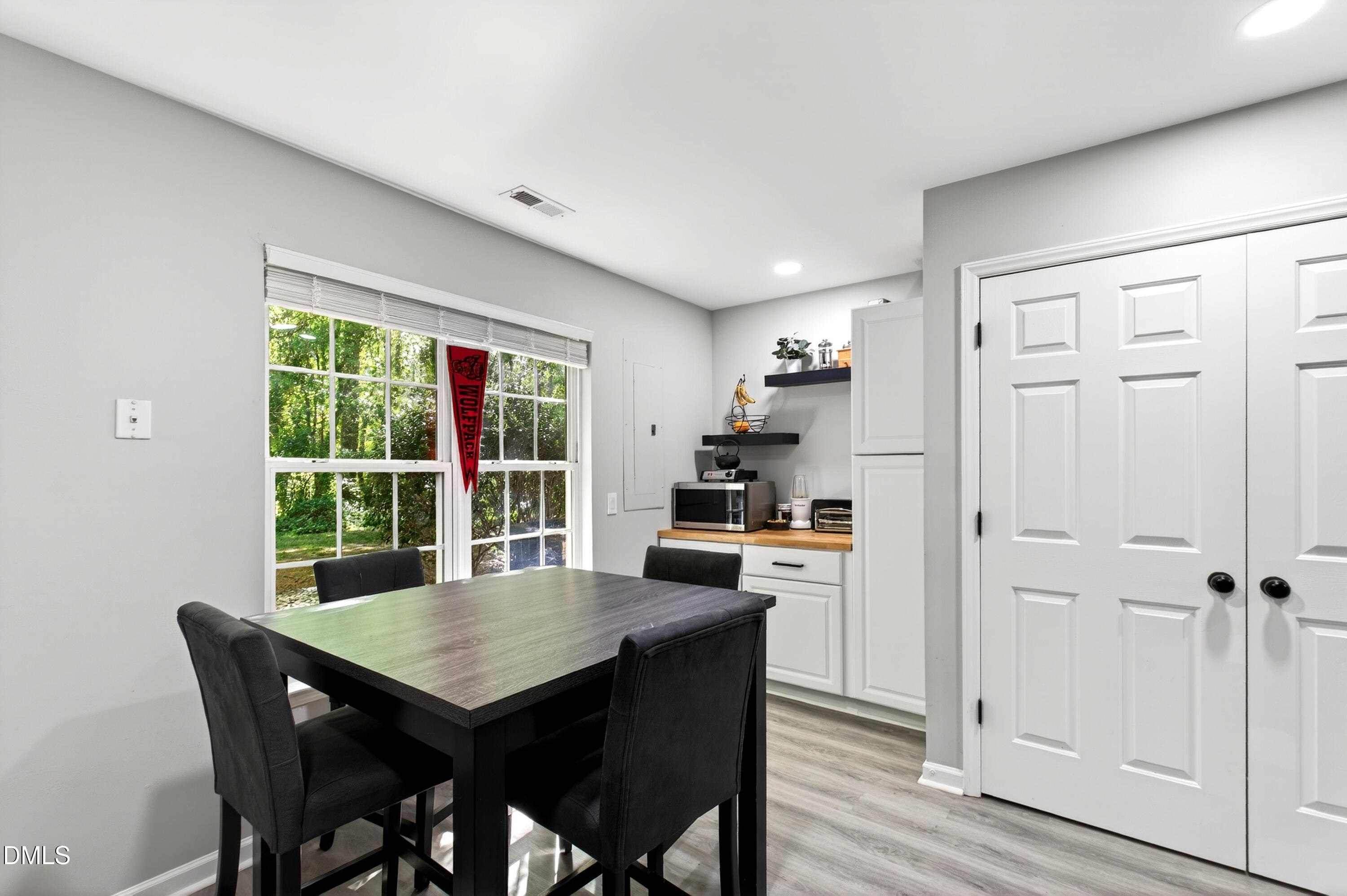 37 Red Lane Raleigh, NC 27606 - Photo 10 of 32 a view of a dining room with furniture window and wooden floor