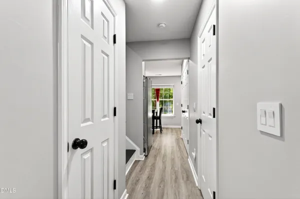a view of a bathroom from a hallway