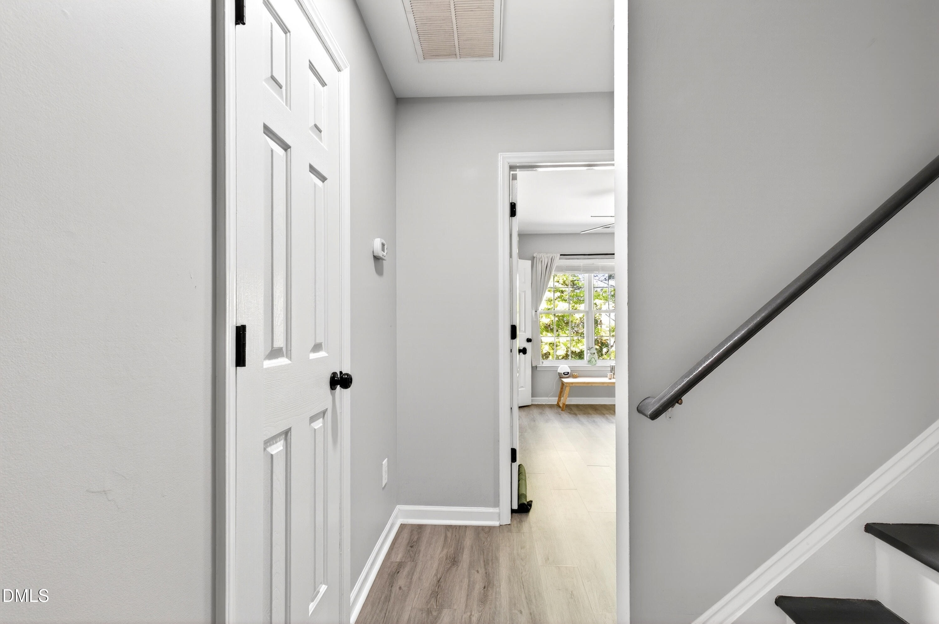 37 Red Lane Raleigh, NC 27606 - Photo 12 of 32 a view of a hallway with wooden floor and staircase